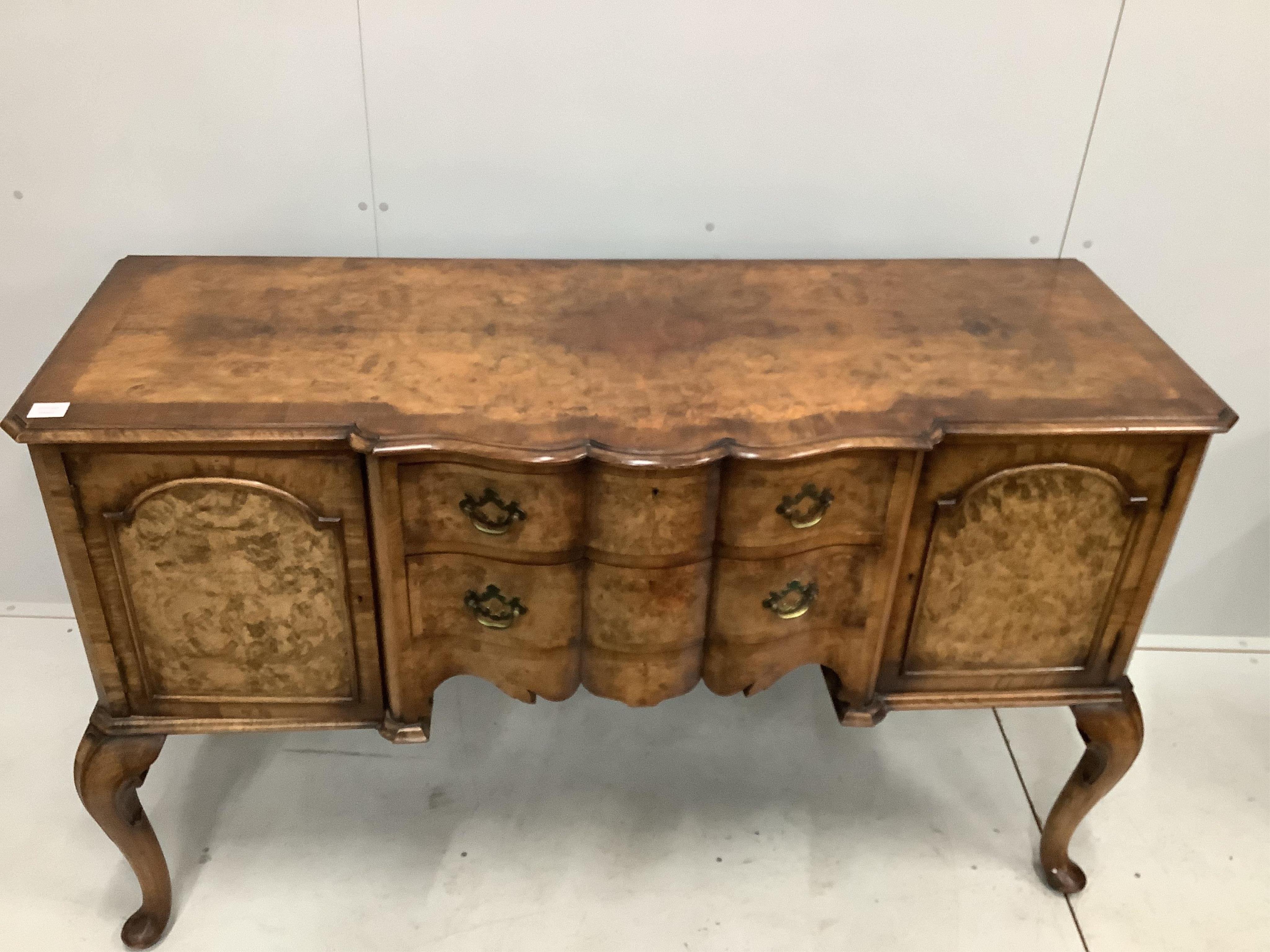 A Queen Anne Revival serpentine walnut sideboard, width 152cm, depth 59cm, height 93cm. Condition - fair